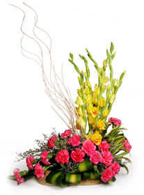 Pink Carnations and Yellow Gladioli in a Basket 
