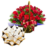 1 Kg Sweets and 12 Roses Basket