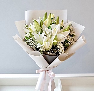 5 White Lilies Bouquet in white paper wrapping