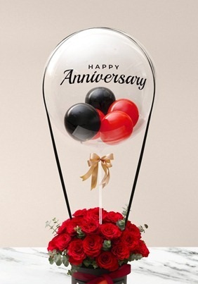 Happy anniversary printed transparent balloon with 4 black and red balloons and 20 red roses arrangement
